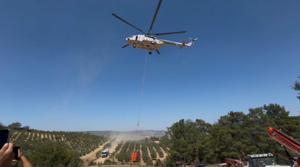 EVİNİ YANGINDAN KORUMAK İÇİN MÜCADELE EDERKEN KALP KRİZİ GEÇİRDİ