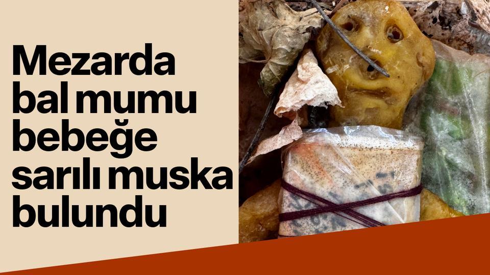 Mezarda bal mumu bebeğe sarılı muska bulundu