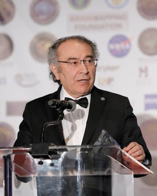 LOS ANGELES, CALIFORNIA - MARCH 16: Professor of Psychiatry and President of Uskudar University Dr. Nevzat Tarhan receives the Golden Axon Award at the 16th annual 'Gathering for Cure' black tie awards gala of Brain Mapping Foundation on March 16, 2019 in Los Angeles, California. (Photo by Tibrina Hobson/Getty Images for Brain Mapping Foundation)