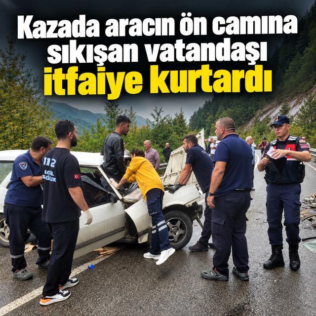 Kazada aracın ön camına sıkışan vatandaşı itfaiye kurtardı
