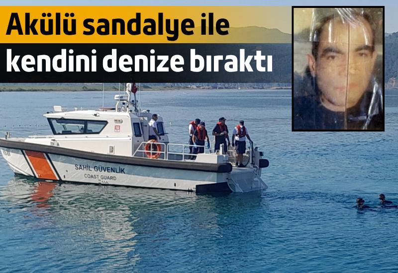 Akülü sandalye ile kendini denize bıraktı