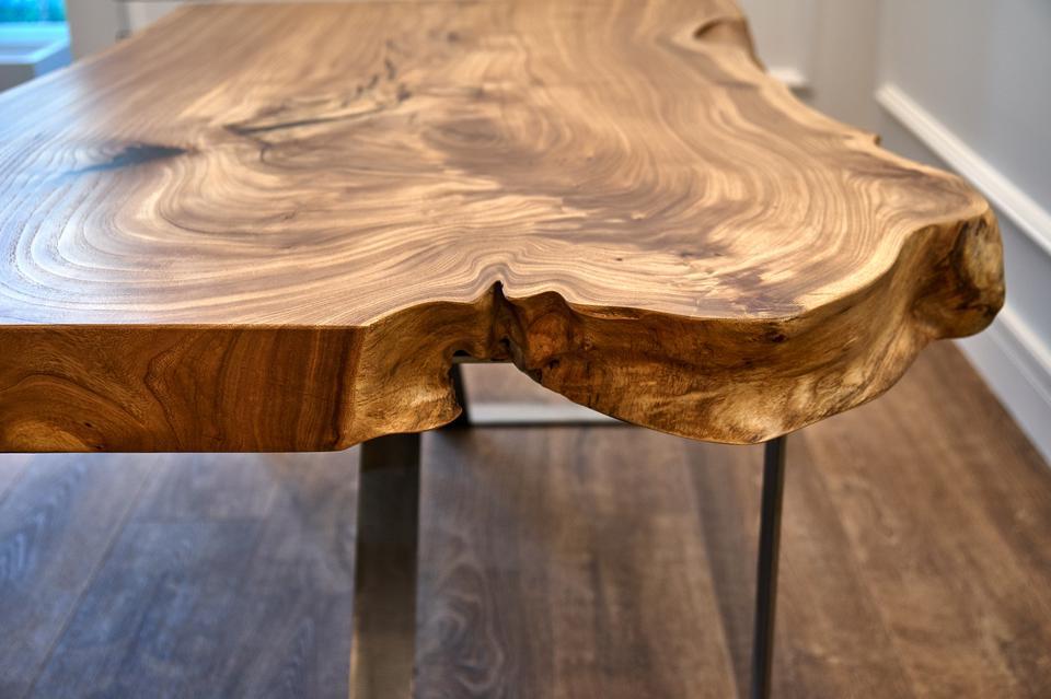 Woodworking and carpentry production. Elm slab coffee table. Close-up. Furniture manufacture